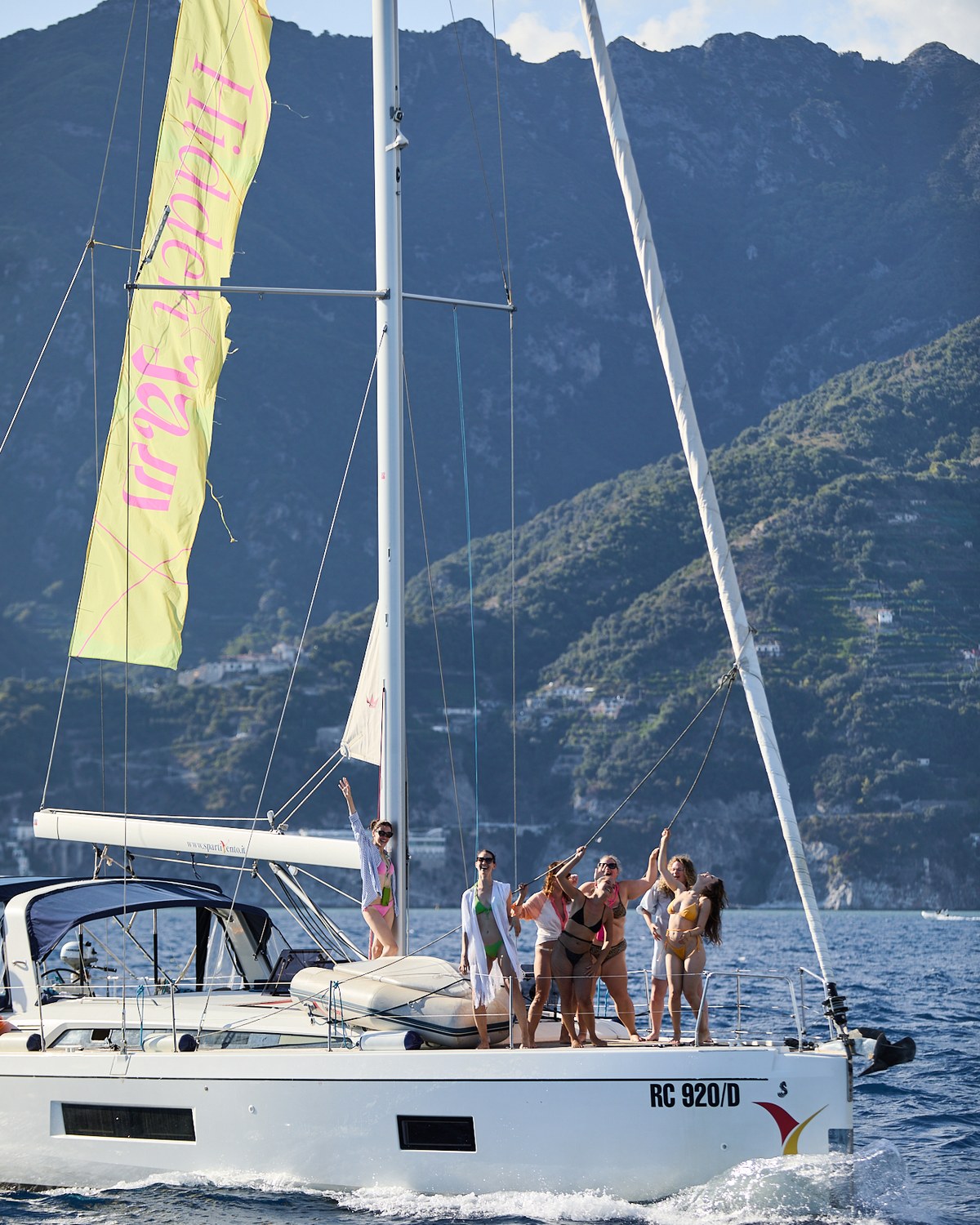 Guests on deck sailing between the islands