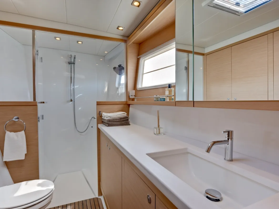 Bathroom with a vanity, sink and a glass shower stall