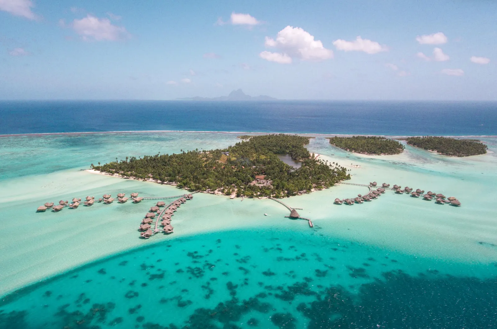 Island and overwater bungalows surrounded by a lagoon