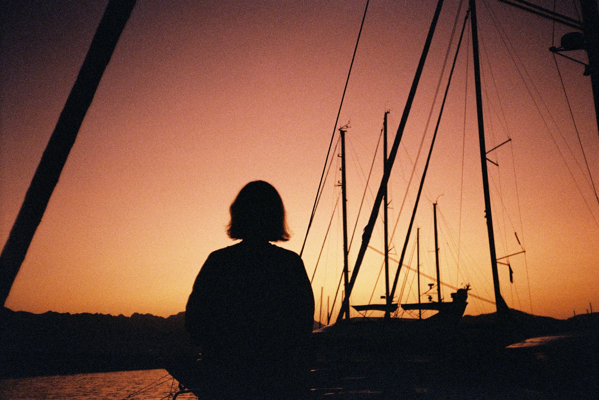 Guest on a sailing yacht at sunset